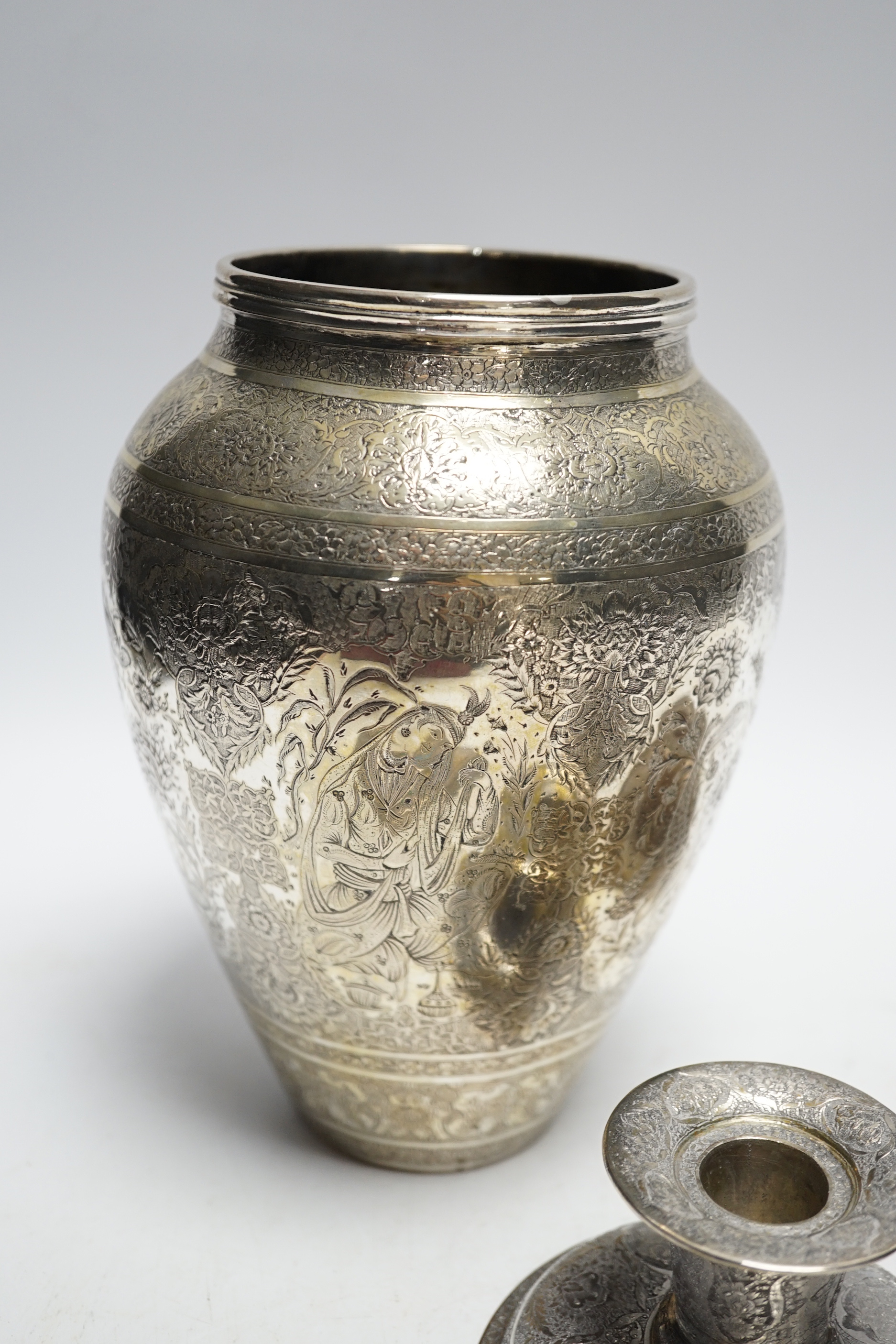 Three Persian white metal dwarf candlesticks including a pair, base 88mm, a similar white metal and enamelled cigarette case and a Persian metal vase.